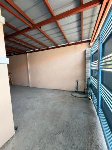 an empty garage with a large room with a ceiling at serene genar in General Trias