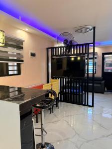a living room with a bar and a tv at serene genar in General Trias