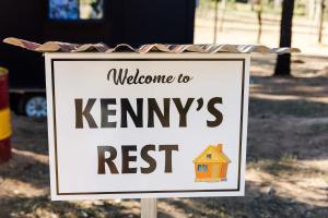 a sign that says welcome to kennys rest at Kenny and Clancy's Camp by Tiny Away in Grandchester