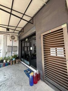 a garage door is open on a building at Kazoku Hostel in Olongapo