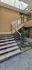 a set of stairs in a building with a lobby at Pino 34 Sobieszewo in Gdańsk