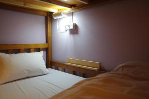 Voodi või voodid majutusasutuse Center.Center Hostel toas