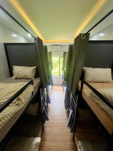 a group of bunk beds in a room at Lunara Homestay in Phú Vang