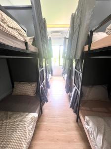 a group of bunk beds in a room at Lunara Homestay in Phú Vang +12 photos