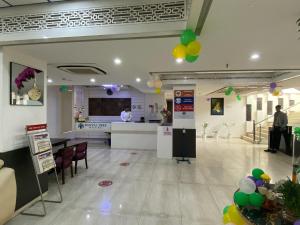 a lobby of a hospital with balloons on the walls at Hotel Banana Tree & Banquets 5 Min From Anand Vihar Bus Terminal and Vaishali Metro Station in Ghaziabad