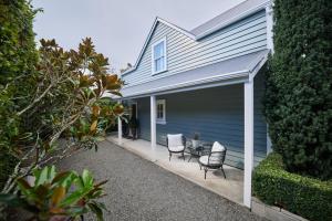 a garage with two chairs and a table on it at Briarwood in Greytown