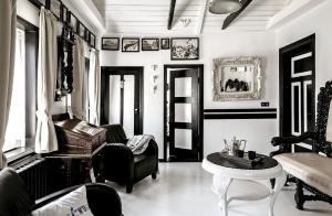a living room with a couch and a table at Boutique Hotel Haus Noge in Westerland
