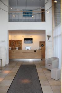 a living room with a couch and a table at RB Hotel Linde in Wangen
