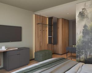 a bedroom with a bed and a flat screen tv at Ziach & Candy Grossarl in Grossarl +91 photos
