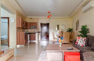 a living room with a couch and a table at La Mirada New Cairo in Cairo