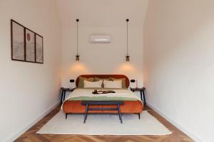 a bedroom with a bed and a table at Folga in Tarnawa Dolna