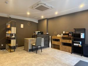 a room with a desk and a chair in it at Ruka Hotel Tennoji in Osaka