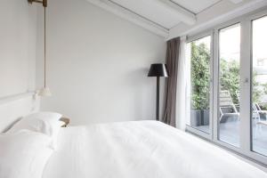 Postel nebo postele na pokoji v ubytování Senato Hotel Milano