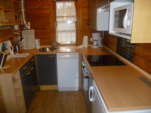 a kitchen with a sink and a stove top oven at Ferienhaus Lauter 57 in Hayingen