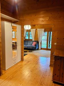 a living room with a couch and a table at Ferienhaus Tauber 29 in Hayingen