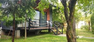 a house with a staircase leading to the front porch at Iskra Tiny House in Podgorica +17 photos