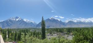a view of a town with mountains in the background at Indus Motel in Skardu