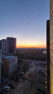 a view of a parking lot in a city at Umayahouses ЖК Орбита in Karagandy