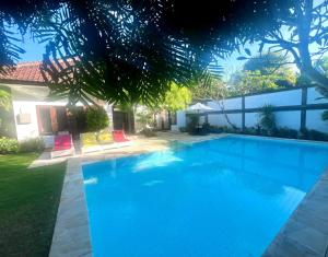 a swimming pool in the yard of a house at Peninsula Villa in Nusa Dua