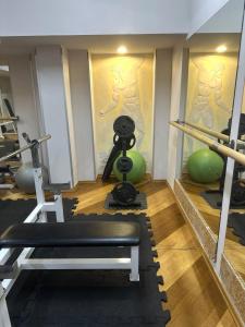 a room with a gym with a camera and weights at Łucka 15 Sweet Home in Warsaw