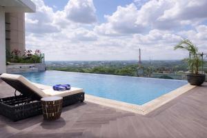 a swimming pool on top of a building at Trans Hotel Jakarta in Cibubur