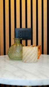 a piece of cheese sitting on a table with a vase at Pini al Mare in Monterosso al Mare +12 photos