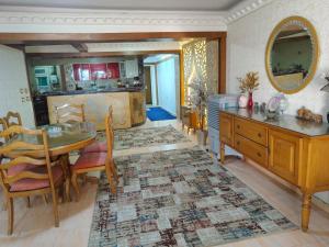 a kitchen with a table and a dining room at luxurious direct seaview apartment in Alexandria