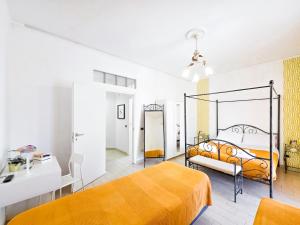 a bedroom with an orange bed in a room at Mamma Lucia in Sorrento
