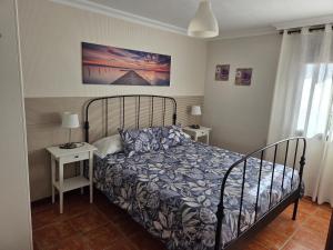 a bedroom with a bed and two night stands at Casa Cielito Lindo in Las Eras +65 photos