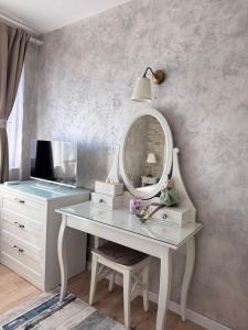 a dressing table with a mirror and a vanity at Boutique apartment Bansko Bell Tower in Bansko
