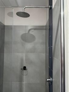 a shower with a glass door in a bathroom at Apartment in joburg in Johannesburg +11 photos
