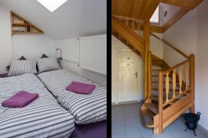 a bedroom with a bed and a stair case at Fair Haven - Dobrej přístav in Lomnice nad Popelkou +24 photos