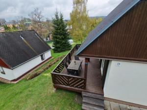 an overhead view of a house with a deck at Chata Větrník u Černého dolu v Krkonoších in Lauterwasser