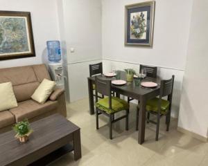a living room with a table and a couch at KAIROS HOME y Garaje , Algemesí Home in Algemesí