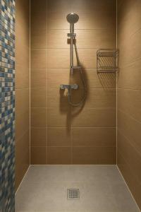 a bathroom with a shower with a shower head at Midi station in Brussels