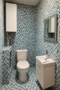 a bathroom with a toilet and a sink at Midi station in Brussels