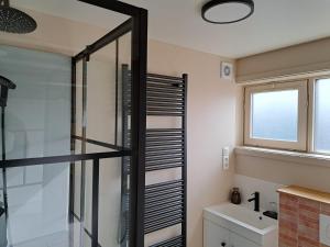 a bathroom with a shower and a sink at Yurt 2-4p in Ravels +25 photos