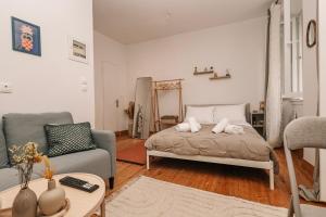 a living room with a bed and a couch at Tonella Studio in Corfu