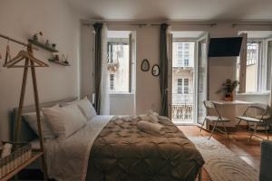 a bedroom with a bed with a teddy bear on it at Tonella Studio in Corfu