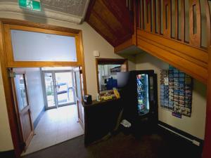 a view of a room with a soda machine at Coogee Beach House in Sydney