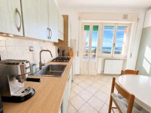 a kitchen with a coffee maker on a counter at Vista Mare nel Corso in San Vincenzo