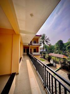 a balcony of a building with a view of the street at Rivera Holidays in Vythiri
