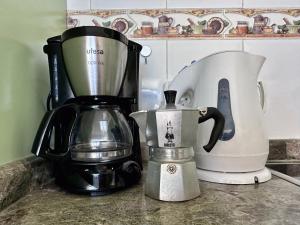 a blender and a coffee maker on a counter at Bungalow Atlantic View in Maspalomas
