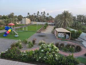 an aerial view of a park with a playground at Katara Garden in As Suwayq