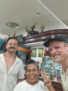 two men and a woman posing for a picture at Bonny Hotel 4 Floors No Elevator in Lamai