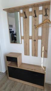 a dressing room with a mirror and a dresser at Schwedenhaus, Am Achterwasser, Urlaub mit Hund in Lütow