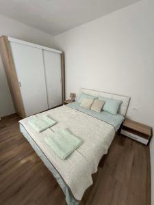 a bedroom with a large bed with two pillows at Central Lux Stay Prilep in Prilep