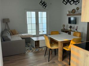 a living room with a table and a couch at Central Lux Stay Prilep in Prilep +7 photos