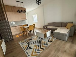 a living room with a couch and a table at Central Lux Stay Prilep in Prilep