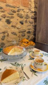 a table with a table cloth with a cake on it at Can Carbó de Peralada in Peralada